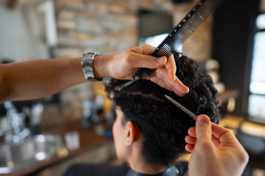 Hair styling process at a salon during daylight
