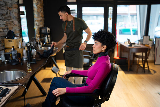 Haircut in a modern salon setting with a stylist