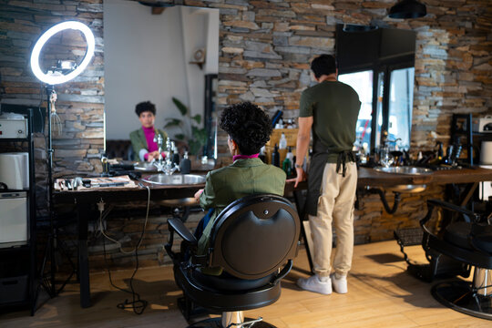 Customer getting a haircut in a salon