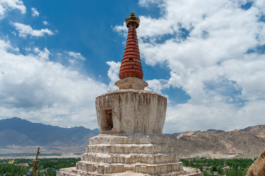 Buddhist stupa above mountain valley in Ladakh, India