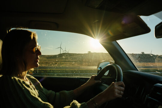 Woman Holding Steering Wheel 