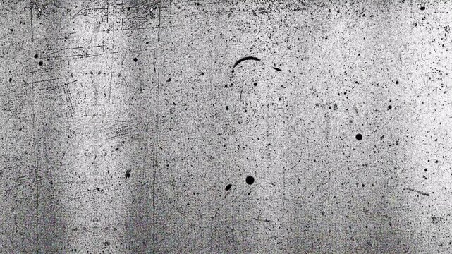 Grainy textured grey concrete and speckled metallic surface, suitable for industrial designs, backgrounds, and textures in projects of various nature.