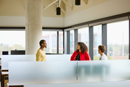 Business Group Discusses Ideas in Modern Office