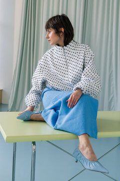 Contemporary Fashion Look with Polka Dot Blouse and Blue Skirt