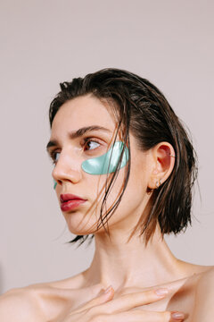Model wearing eye patches on her face
