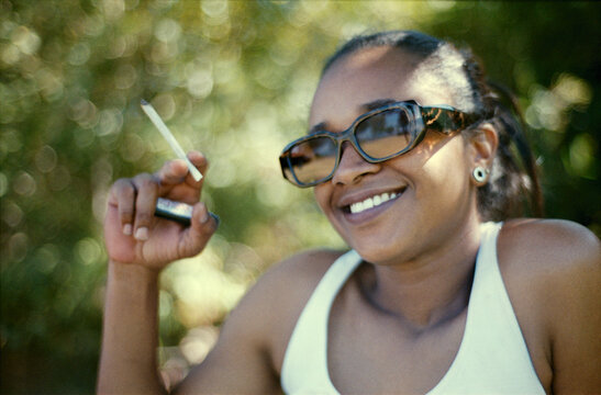 Smiling With Lit Joint