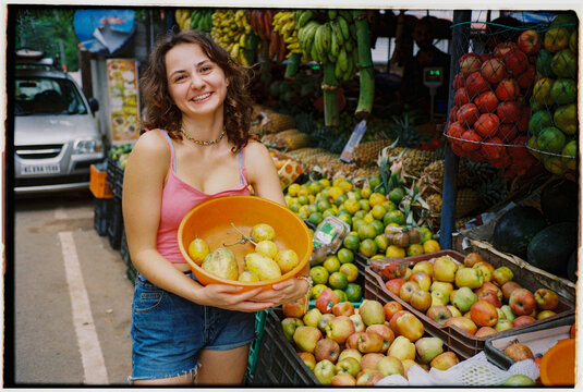 Woman buying fruits on the market 