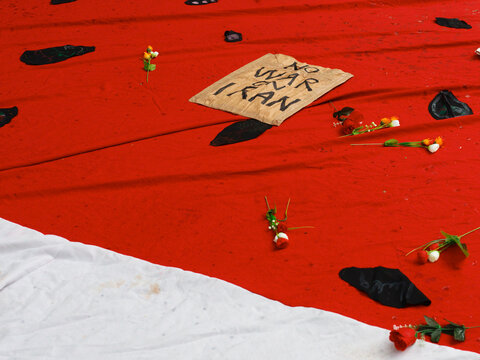Large Red Watermelon Symbol and  a Sign for Peace in Iran