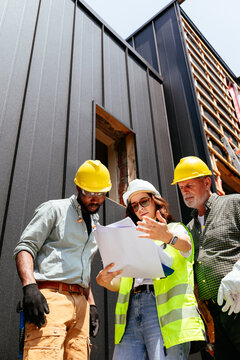 Construction Workers with Architect