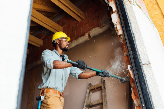 Construction Worker doing Demolition