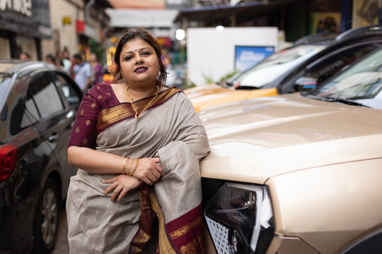 Indian woman wearing traditional sari dress in a metropolitan city 