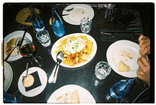 Dinner Table With Various Dishes and Drinks in a restaurant
