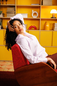 Woman Embracing a Business Lifestyle in Modern Yellow Interior