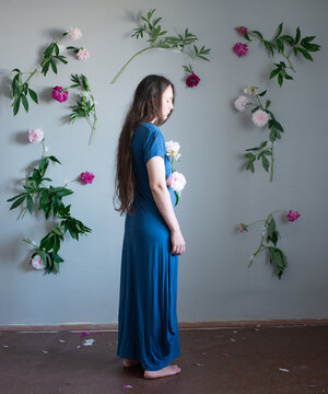 Woman standed full body surrounded by flowers 13