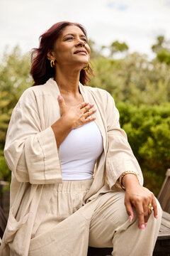 Woman Enjoys Fresh Air during her relaxed vacations.