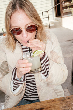 Candid Drinking Margarita
