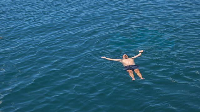 Man Relaxing in the Ocean