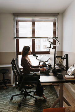 Businesswoman working in home office.