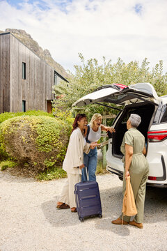 Taking the suitcases out of the car trunk
