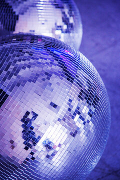 Disco ball in violet blue light closeup