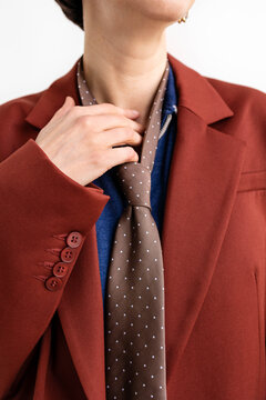 A woman in a tie and jacket