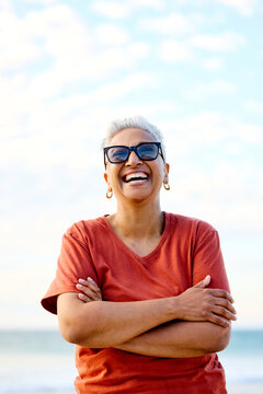 Portrait of Woman Smiles at the Beach During Sunset