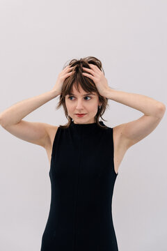 Short Hair Portrait with Hands Raised Studio Side Gaze