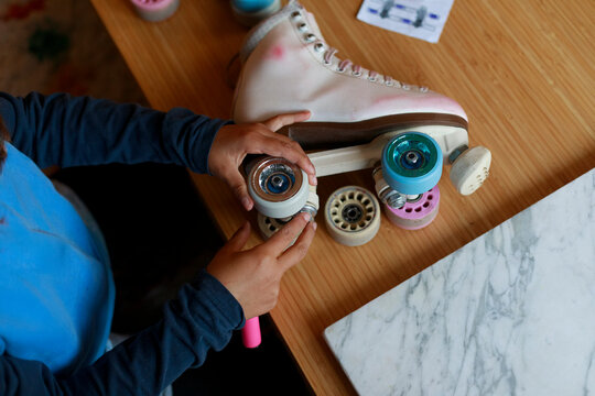 Child fixing roller skate