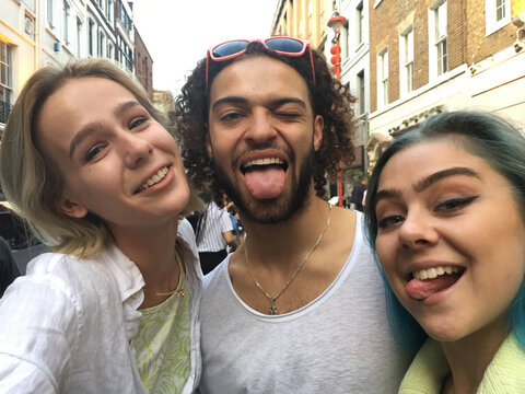 Three friends take a selfie, London