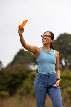 Confident Asian fitness smile selfie cell phone Portrait 