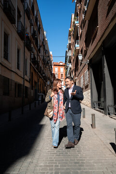 Mature couple enjoying urban date walking together