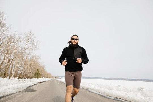 Runner on winter road