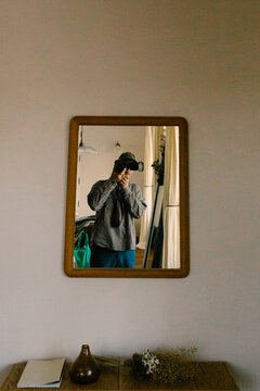 A self-portrait of a photographer, looking at himself in a mirror