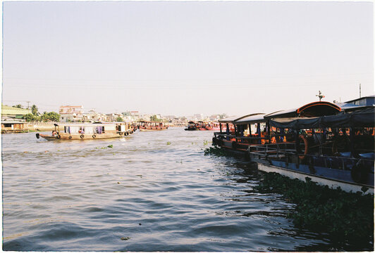 Vessels move through a river in Mekong Delta, Floating market Vietnam