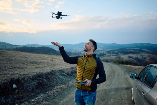 Smiling man deployed his drone.