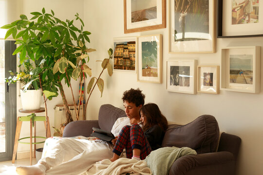 Boy and girl sharing screen at home