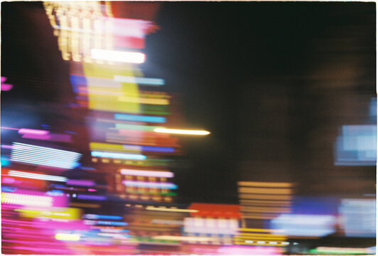 City lights create bright patterns at night captured on Film