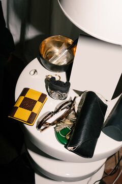 A close-up shot, lit by direct flash, of a desk with personal items