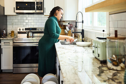 Working in the Kitchen, Washing Dishes
