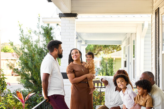 A Family Gathers on the Porch