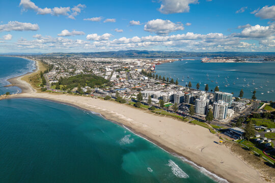 Aerial view of Mount Maunganui, a coastal suburb of Tauranga, New Zealand. It is a popular summer destination for its long sandy beach