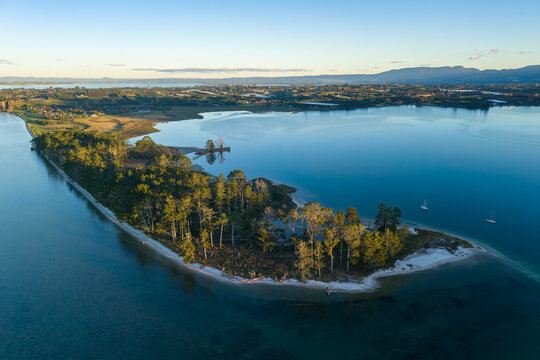 Aerial view of Tuapiro Point, a wooded sandspit and nature reserve in the Bay of Plenty, New Zealand