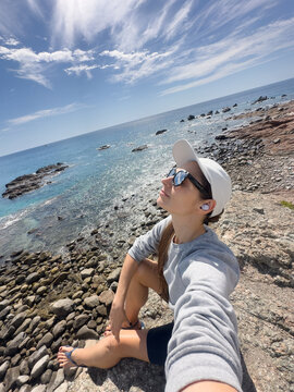 ugc selfie of a woman on a cliff