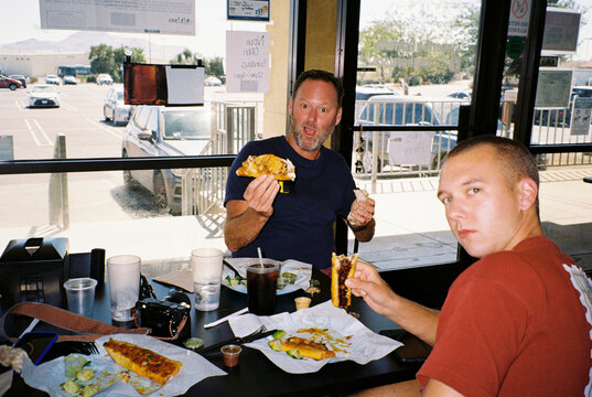 Friends Eating Food in a Restaurant on a roadtrip
