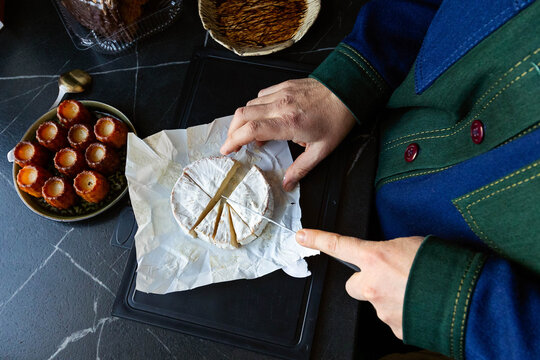 A woman is cutting food.