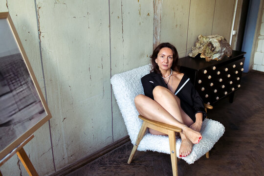 A woman spends time in her furniture restoration studio