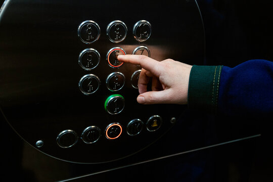Pressing a button in an elevator
