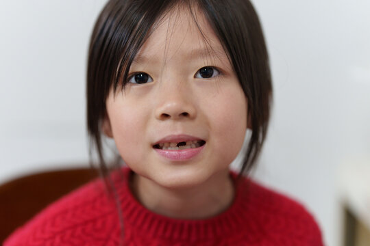 Girl with One Missing Front Tooth