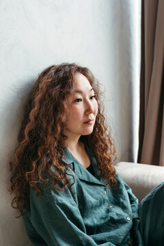 Thoughtful Woman in a Serene Moment by the Window