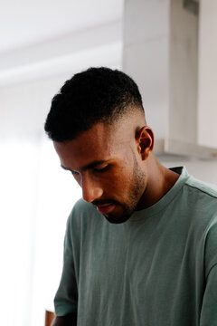 Portrait of a Black man with a weary expression on his face